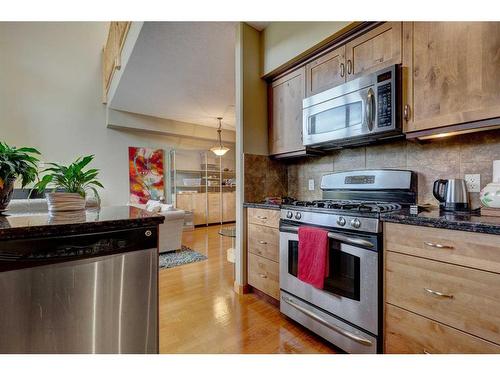 222-107 Armstrong Place, Canmore, AB - Indoor Photo Showing Kitchen With Stainless Steel Kitchen