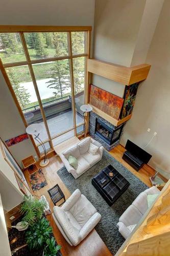 222-107 Armstrong Place, Canmore, AB - Indoor With Fireplace