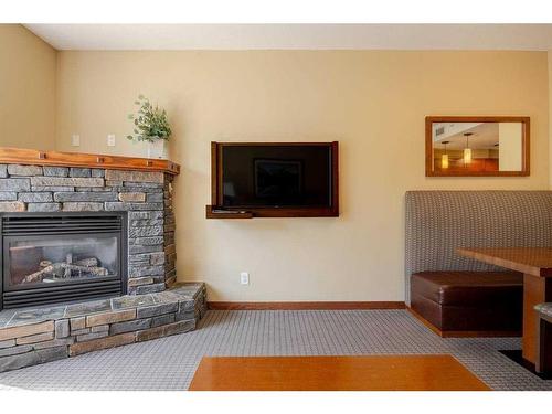 216-190 Kananaskis Way, Canmore, AB - Indoor Photo Showing Living Room With Fireplace