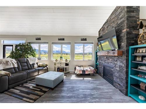 516B Seabolt Estates, Rural Yellowhead County, AB - Indoor Photo Showing Living Room With Fireplace