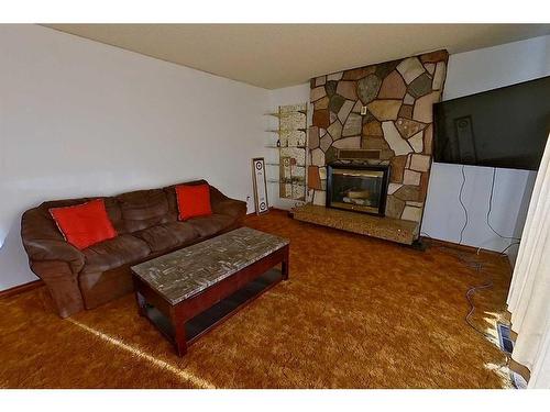 682004-Range Road 220.5, Rural Athabasca County, AB - Indoor Photo Showing Living Room With Fireplace