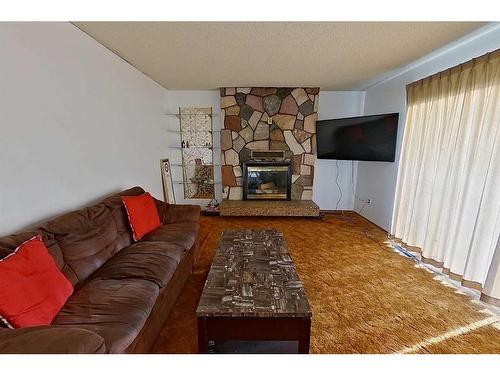 682004-Range Road 220.5, Rural Athabasca County, AB - Indoor Photo Showing Living Room With Fireplace