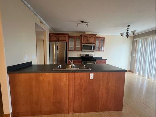 #303-4330A 55 Avenue, Whitecourt, AB - Indoor Photo Showing Kitchen With Double Sink