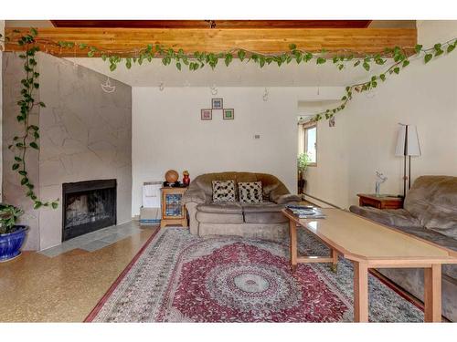 1-426 Marten Street, Banff, AB - Indoor Photo Showing Living Room With Fireplace