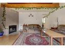 1-426 Marten Street, Banff, AB  - Indoor Photo Showing Living Room With Fireplace 