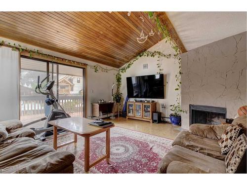 1-426 Marten Street, Banff, AB - Indoor Photo Showing Living Room With Fireplace