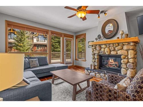 309-701 Benchlands Trail, Canmore, AB - Indoor Photo Showing Living Room With Fireplace