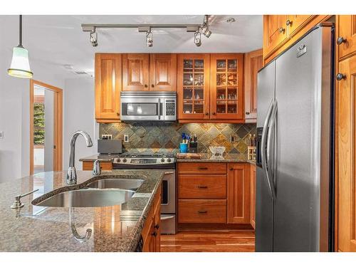 309-701 Benchlands Trail, Canmore, AB - Indoor Photo Showing Kitchen With Stainless Steel Kitchen With Double Sink With Upgraded Kitchen