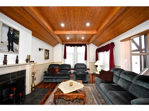 105 Mcpherson Square Square, Hinton, AB - Indoor Photo Showing Living Room With Fireplace