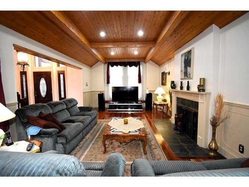 105 Mcpherson Square Square, Hinton, AB - Indoor Photo Showing Living Room With Fireplace