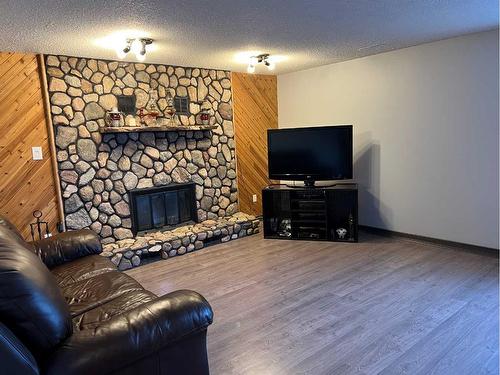 708 8 Street, Fox Creek, AB - Indoor Photo Showing Living Room With Fireplace