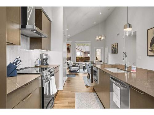 301B-209 Stewart Creek Rise, Canmore, AB - Indoor Photo Showing Kitchen With Stainless Steel Kitchen With Upgraded Kitchen