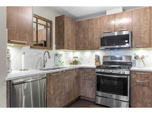 701-102 Stewart Creek Rise, Canmore, AB - Indoor Photo Showing Kitchen