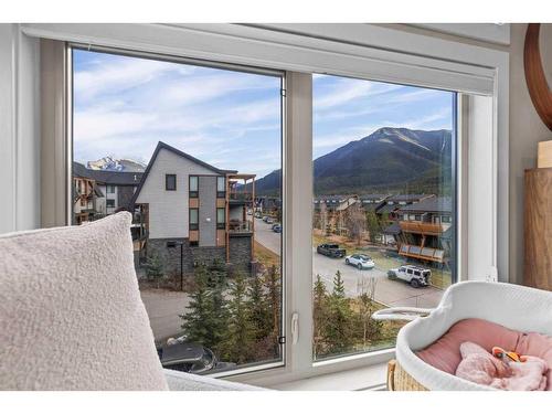 701-102 Stewart Creek Rise, Canmore, AB - Indoor Photo Showing Bedroom