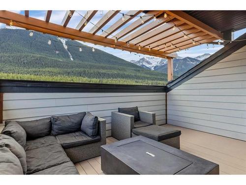 701-102 Stewart Creek Rise, Canmore, AB - Outdoor With Deck Patio Veranda With Exterior