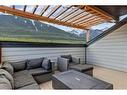 701-102 Stewart Creek Rise, Canmore, AB  - Outdoor With Deck Patio Veranda With Exterior 