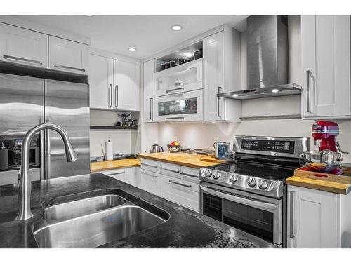 922 Lawrence Grassi Ridge, Canmore, AB - Indoor Photo Showing Kitchen With Stainless Steel Kitchen With Double Sink With Upgraded Kitchen