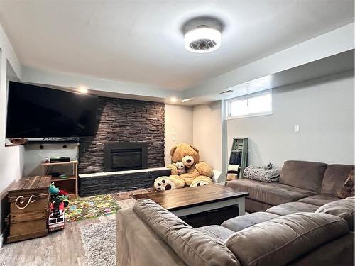 80 Chickadee Drive, Whitecourt, AB - Indoor Photo Showing Living Room With Fireplace