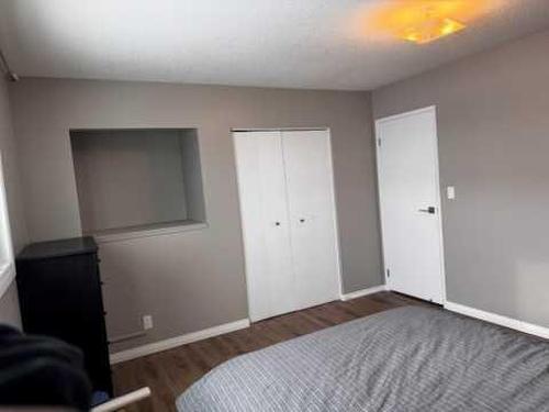 208 Slade Drive, Nanton, AB - Indoor Photo Showing Bedroom