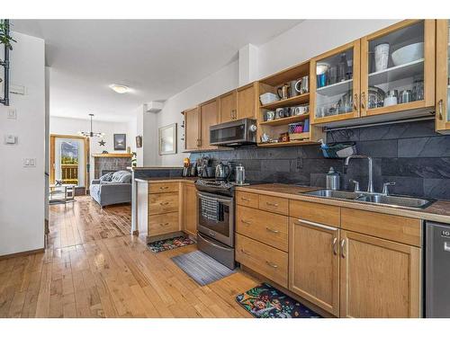 150-901 Benchlands Trail Nw, Canmore, AB - Indoor Photo Showing Kitchen With Double Sink