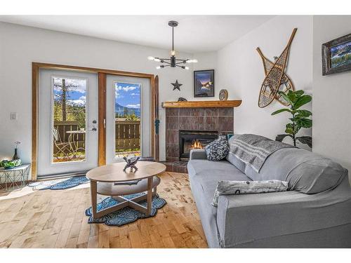 150-901 Benchlands Trail Nw, Canmore, AB - Indoor Photo Showing Living Room With Fireplace