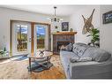 150-901 Benchlands Trail Nw, Canmore, AB  - Indoor Photo Showing Living Room With Fireplace 