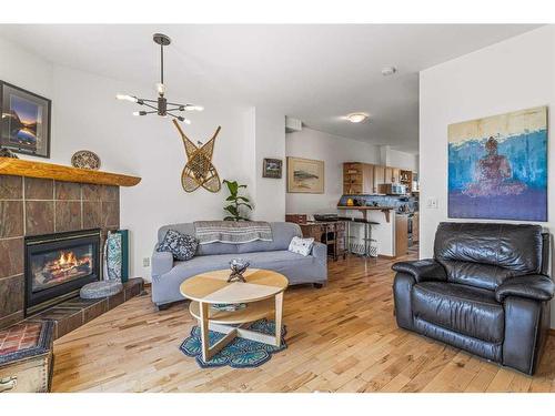 150-901 Benchlands Trail Nw, Canmore, AB - Indoor Photo Showing Living Room With Fireplace