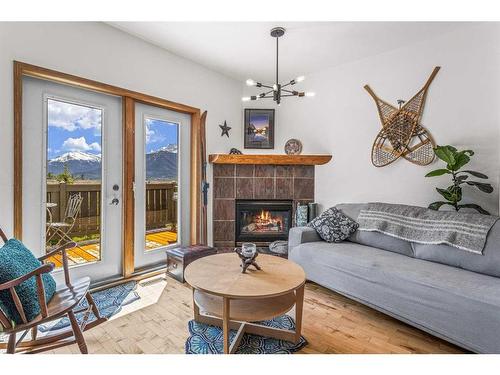 150-901 Benchlands Trail Nw, Canmore, AB - Indoor Photo Showing Living Room With Fireplace