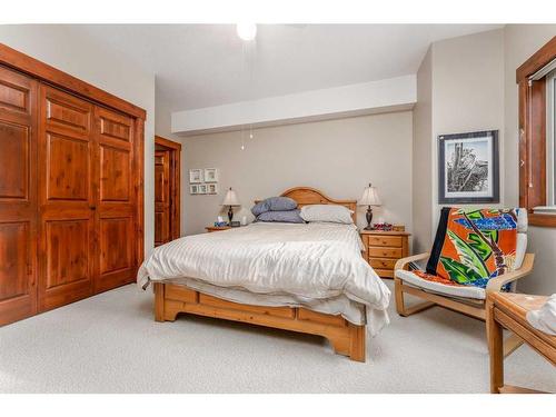 207-155 Crossbow Place, Canmore, AB - Indoor Photo Showing Bedroom