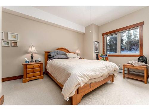 207-155 Crossbow Place, Canmore, AB - Indoor Photo Showing Bedroom