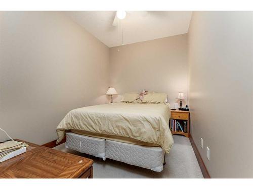 207-155 Crossbow Place, Canmore, AB - Indoor Photo Showing Bedroom