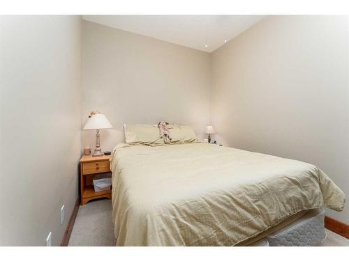 207-155 Crossbow Place, Canmore, AB - Indoor Photo Showing Bedroom