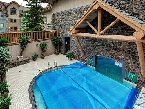 207-155 Crossbow Place, Canmore, AB - Outdoor With In Ground Pool With Exterior