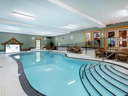 207-155 Crossbow Place, Canmore, AB - Indoor Photo Showing Other Room With In Ground Pool