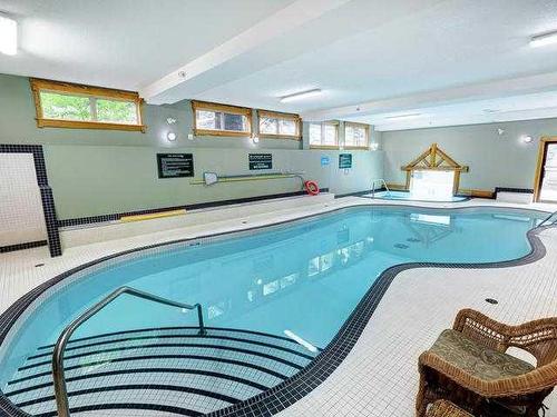 207-155 Crossbow Place, Canmore, AB - Indoor Photo Showing Other Room With In Ground Pool