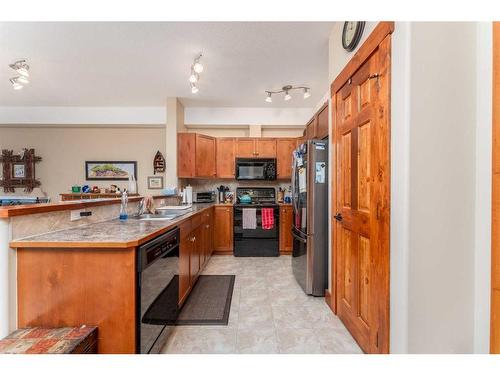 207-155 Crossbow Place, Canmore, AB - Indoor Photo Showing Kitchen