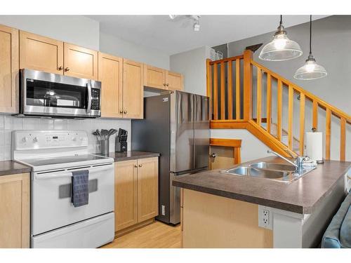 323-107 Montane Road, Canmore, AB - Indoor Photo Showing Kitchen With Double Sink