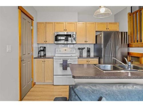 323-107 Montane Road, Canmore, AB - Indoor Photo Showing Kitchen With Double Sink