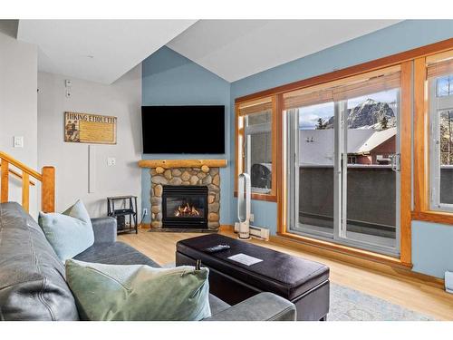 323-107 Montane Road, Canmore, AB - Indoor Photo Showing Living Room With Fireplace