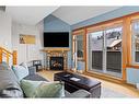 323-107 Montane Road, Canmore, AB  - Indoor Photo Showing Living Room With Fireplace 