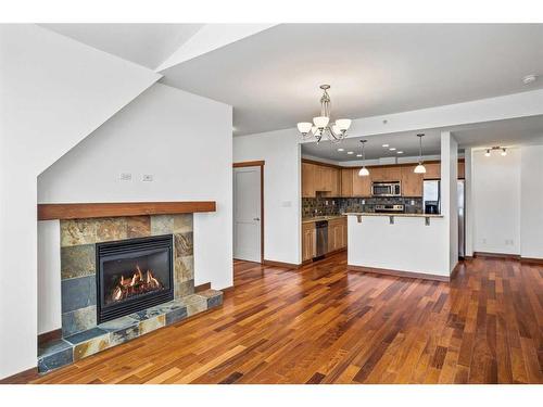 307-1002 8Th Avenue, Canmore, AB - Indoor With Fireplace