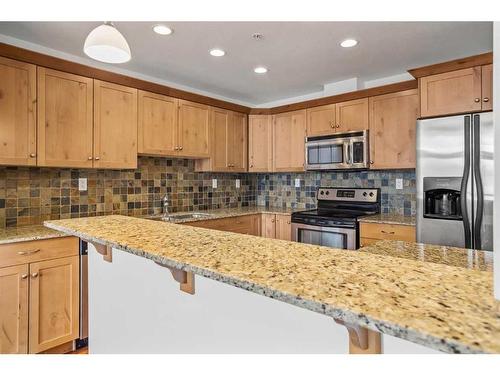 307-1002 8Th Avenue, Canmore, AB - Indoor Photo Showing Kitchen With Stainless Steel Kitchen With Double Sink With Upgraded Kitchen