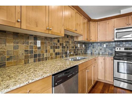 307-1002 8Th Avenue, Canmore, AB - Indoor Photo Showing Kitchen With Stainless Steel Kitchen With Double Sink