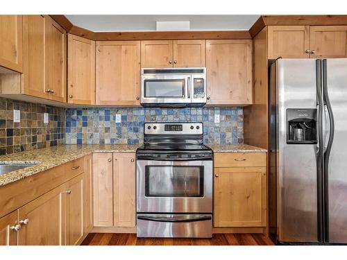 307-1002 8Th Avenue, Canmore, AB - Indoor Photo Showing Kitchen With Stainless Steel Kitchen