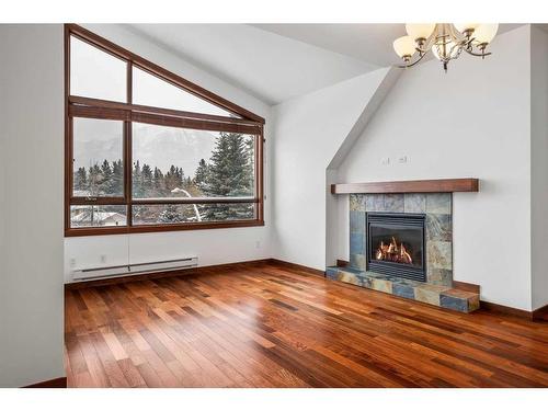 307-1002 8Th Avenue, Canmore, AB - Indoor Photo Showing Living Room With Fireplace