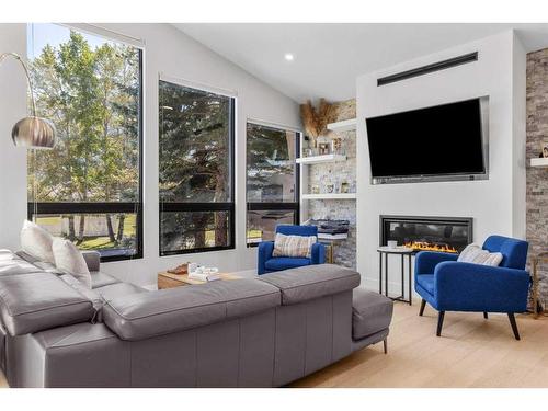 1010 14 Street, Canmore, AB - Indoor Photo Showing Living Room With Fireplace