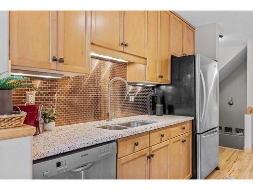 53-127 Carey, Canmore, AB - Indoor Photo Showing Kitchen With Double Sink