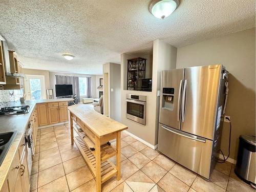 703 3 Avenue, Fox Creek, AB - Indoor Photo Showing Kitchen With Stainless Steel Kitchen With Double Sink