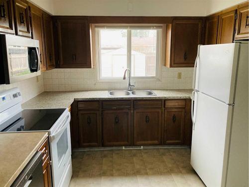 10 Blueberry Drive, Whitecourt, AB - Indoor Photo Showing Kitchen With Double Sink