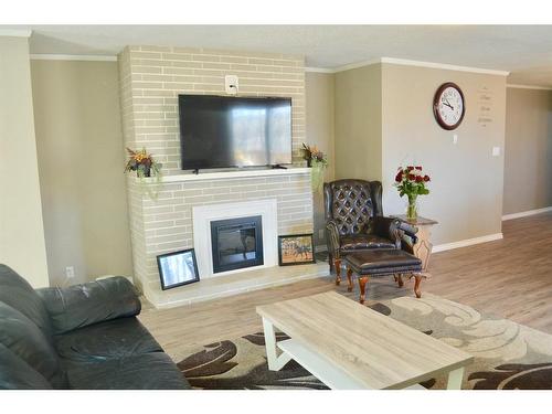 4913 54 Street, Athabasca, AB - Indoor Photo Showing Living Room With Fireplace